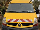 a yellow van that is parked on the side of the road