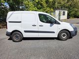 a white van that is parked on the side of the road