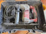 a tool in a tool box on a wooden floor