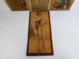 a picture of a woman in a bathing suit hanging on a wall