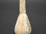 a small vase that is sitting on a black surface