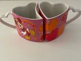 mickey and minnie mouse mugs on a white counter top