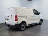 a picture of a white van parked in a garage