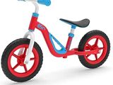 red, white and blue tricycle on a white background