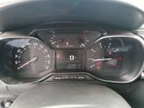 a close up of a car dashboard with a speedometer and gauges