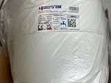 a large white object wrapped in plastic sitting on top of a table