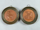 deux médaillons en bronze représentant une femme et un homme