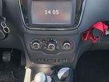 a dashboard of a small car with a clock on it