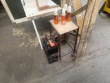 a small table with a laptop on top of it