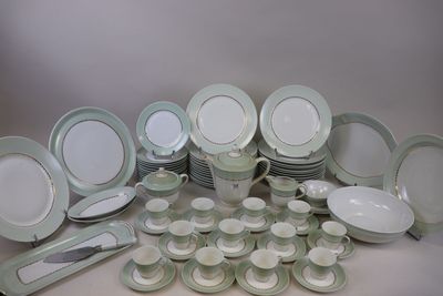 many different types of plates and bowls on the table