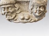 an image of a sculpture of a man and a woman on a rock