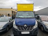 une camionnette bleue avec une caisse jaune à l'arrière
