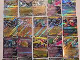 a close up of a bunch of pokemon cards on a table