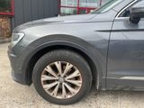 a close up of a car ' s tire on the road