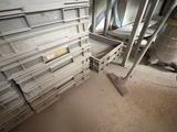 a room with a lot of shelves and a ladder
