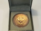 an image of a gold coin with a lion head on it