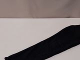 a pair of black leggings sitting on top of a white table