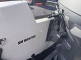 a white boat with a black and white logo on it