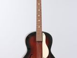 a close up of a guitar on a white background
