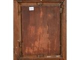 an old wooden frame with a sign hanging on it