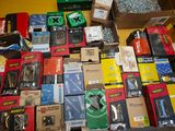 many boxes of assorted electronic devices on the floor