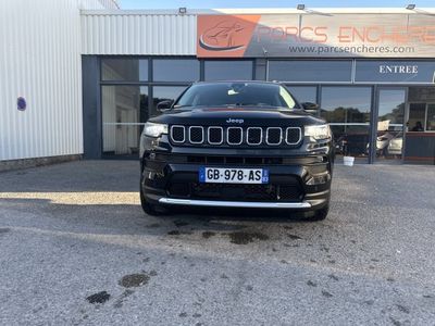 a black jeep is parked in front of a building