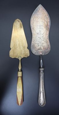 three different types of knives on a black surface