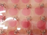 pink and white polka dot fabric with silver circles on it