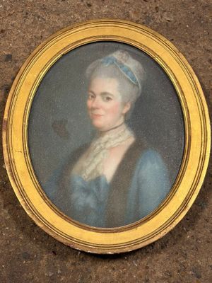 portrait of a woman in a blue dress with a white hat
