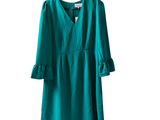 an image of a green dress hanging on a hanger