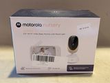 the motorola baby monitor is in the box on the table
