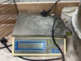 an image of a kitchen scale with a brush on it