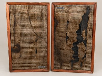 pair of mid - century speakers with woven panels and wooden frame