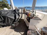 a black cover on the back of a boat with bottles on it
