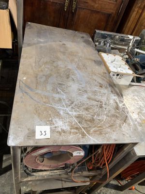 a table that has a lot of stuff on top of it