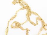 a gold necklace with a chain that is attached to it