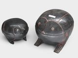 pair of black and red pottery figurines of a turtle and a turtle