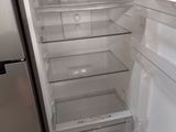 an open refrigerator with the door open and the freezer door open