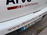 a white van parked on the side of the road
