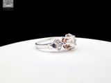 an image of a diamond ring on a white plate