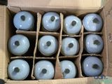 a cardboard box filled with lots of blue balls
