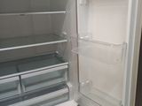 an open refrigerator with the door open and the freezer door open