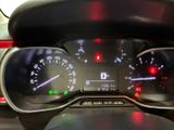 a close up of a car dashboard with a speedometer and gauges
