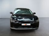 a picture of a black car parked in a showroom