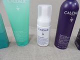 several different types of skin care products are lined up on a table