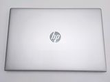 hp laptop computer sitting on a white surface with a logo on the screen