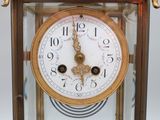 a clock that is sitting in a glass case