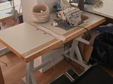 an image of a sewing room with a desk and chair