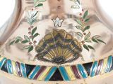 a silver vase with a butterfly decoration on it