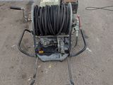 a hose on the ground next to a water hose
